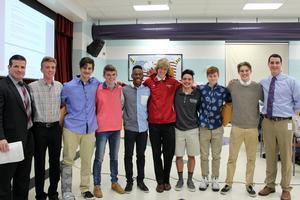 Members of the boys indoor track team with Athletic Director Chris Campolieta and Superintendent Matthew McDonald
