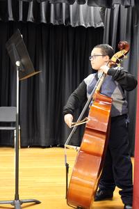 student playing a bass