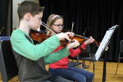 children play the violin