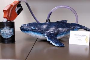 a ceramic sculpture of a whale
