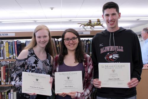 three students holding certificates