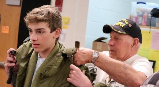 Local  veteran brings military collection to Durgee Junior High School